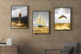 Modern framed marine wall art, seascape canvas print in floating frame, set of 3 prints in gold grey colors, painting with dolphin and ship